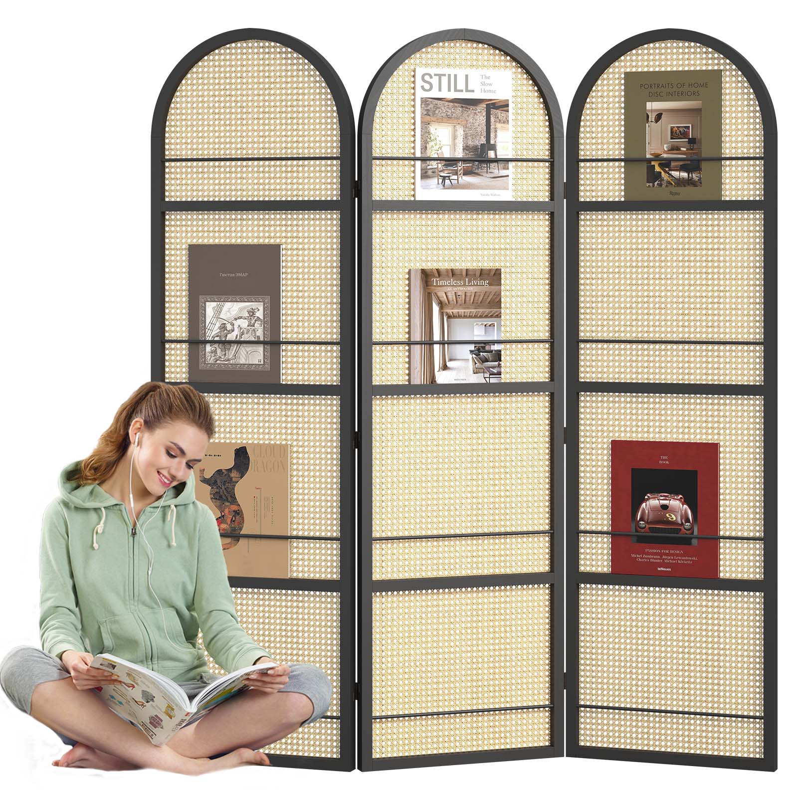Close up of sleek black wooden rails displaying art books and magazines on the front of an arched divider
