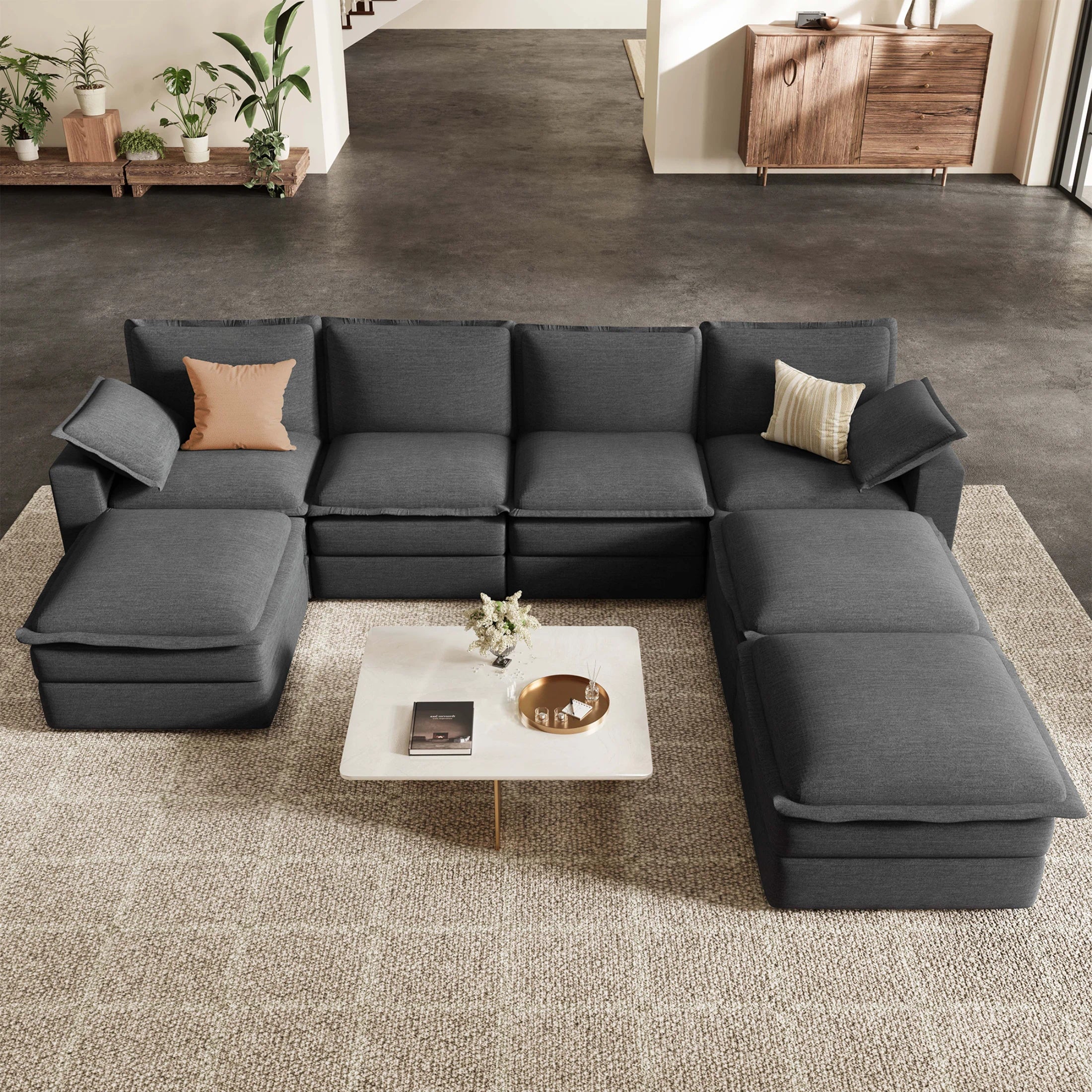 A spacious **7 seater u shape sectional sofa** in dark gray featuring **movable ottomans** for a flexible and comfortable modular living room layout