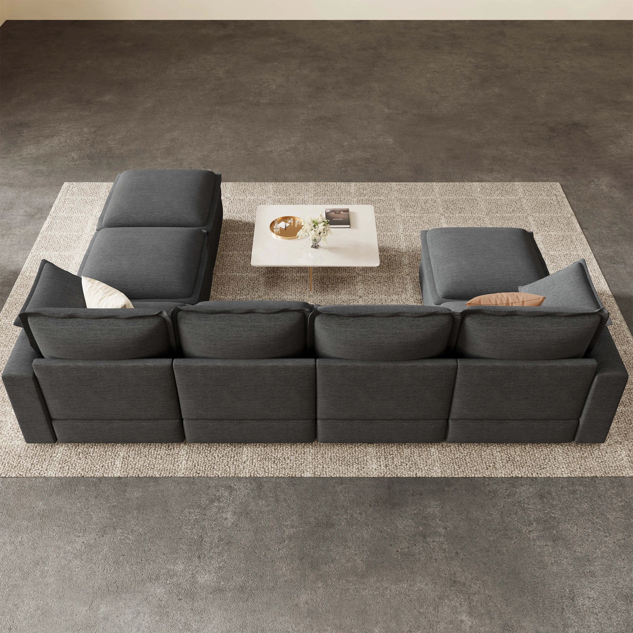 Rear top view of Densa 125" modular U-shaped cloud sofa in dark gray, showcasing the 7-seater conversation pit layout in a modern living room