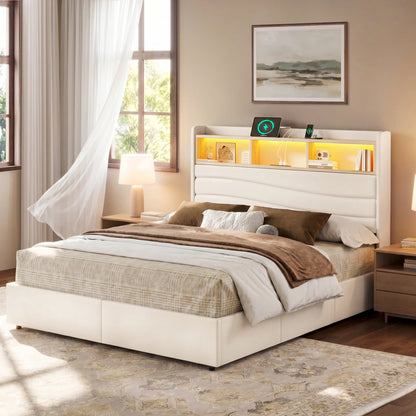 A modern beige upholstered bed frame with a built-in headboard and integrated shelving, shown in a styled bedroom setting with bedding, bedside tables, lamps, and a window.