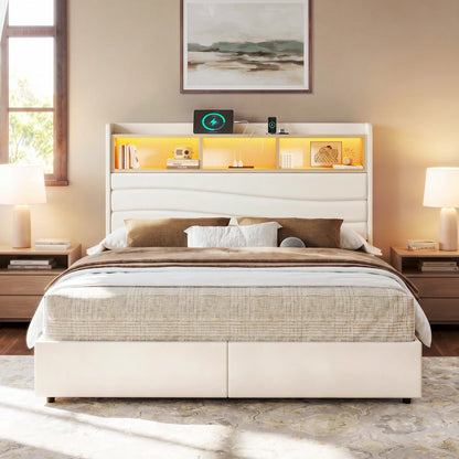 Front view of the Aura beige upholstered storage bed frame with a sculpted headboard and two footboard drawers.