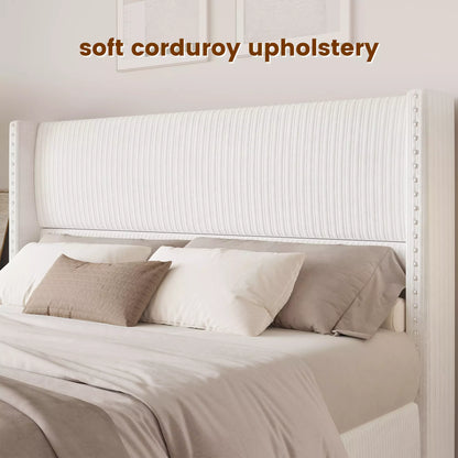 Close-up of Elysia soft white corduroy upholstery and silver nailhead trim on the tall wingback headboard.