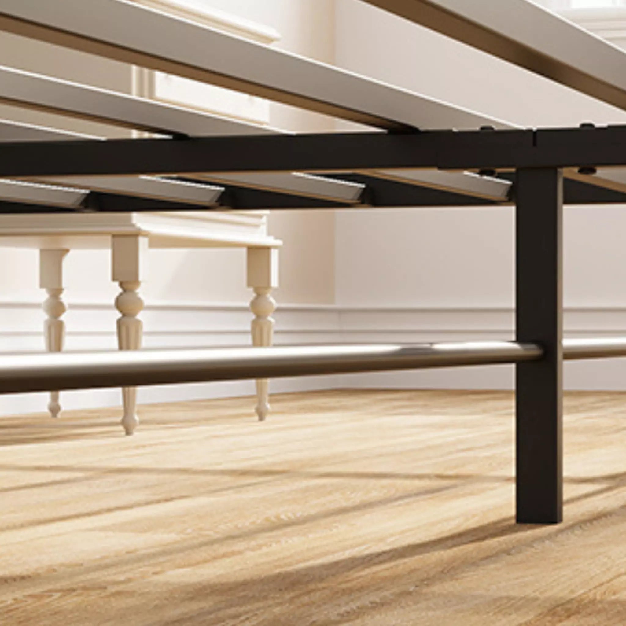 Metal bed frame on a wooden floor with white walls