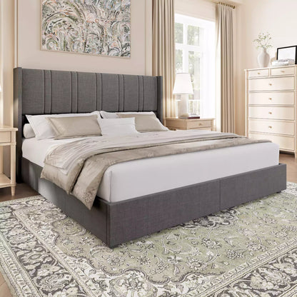 Bedroom with a gray upholstered bed, white bedding, and decorative elements.