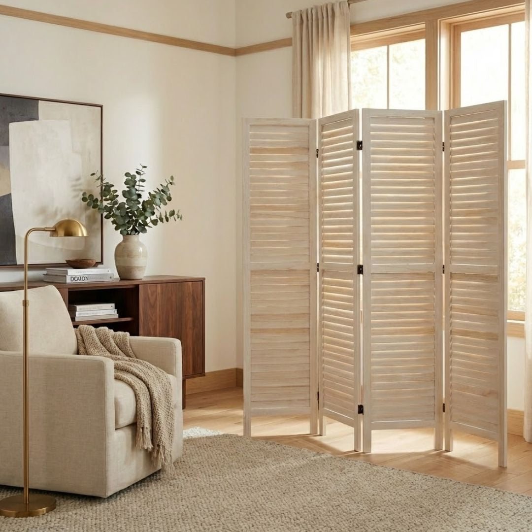 White 4-panel louvered room divider freestanding privacy screen in a modern bright bedroom.