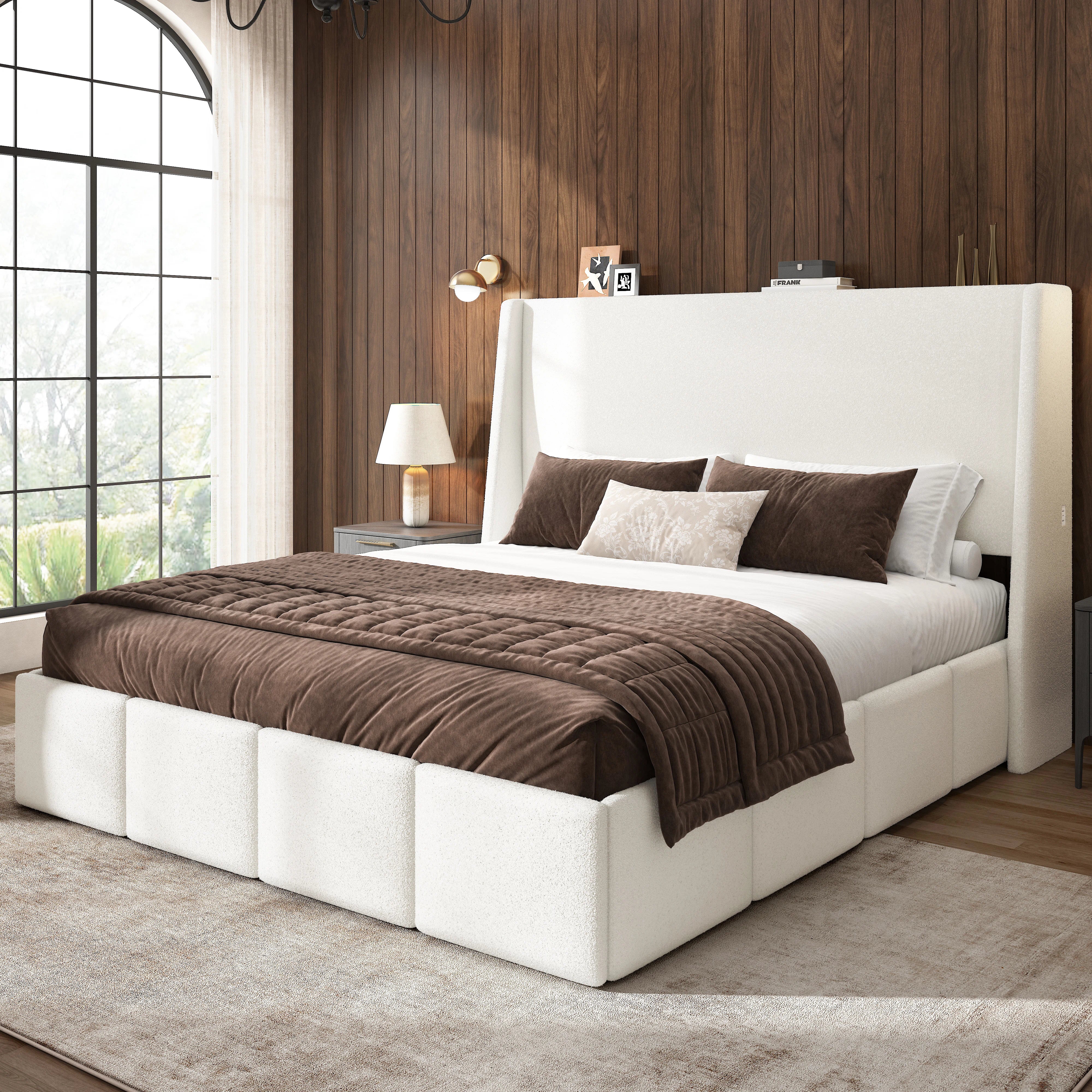 White sherpa upholstered platform bed frame styled with cozy brown bedding